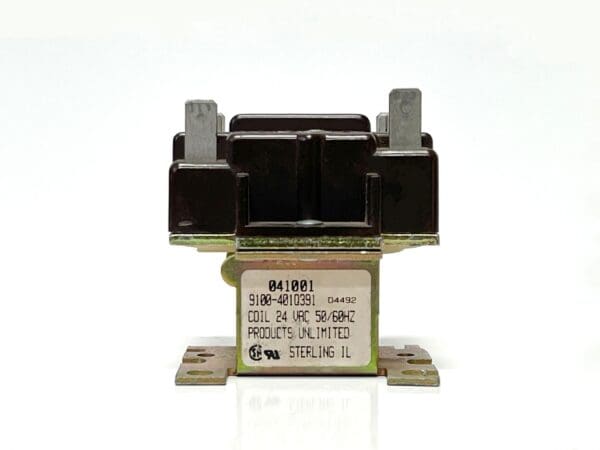 A close up of an electrical relay on top of a white background