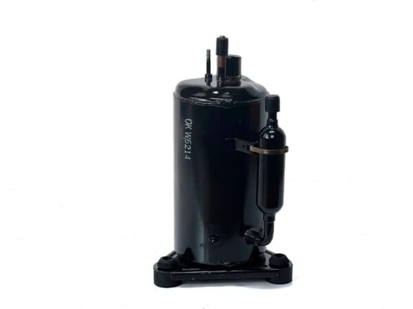 A black air compressor on top of a white table.