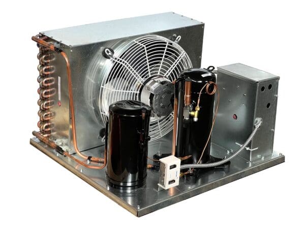 A fan and two capacitors are on the side of an air conditioner.