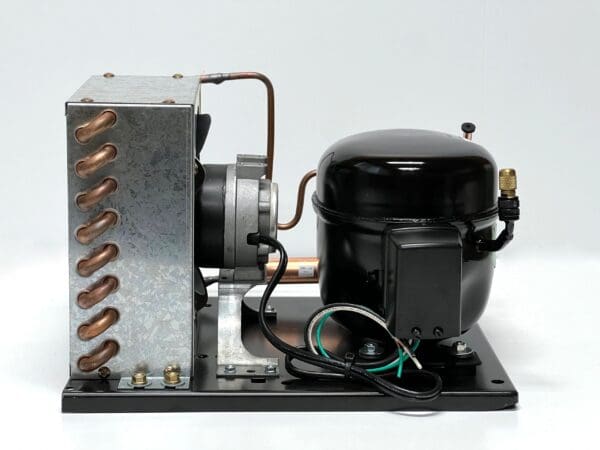 A compressor is connected to the coil of an air conditioner.
