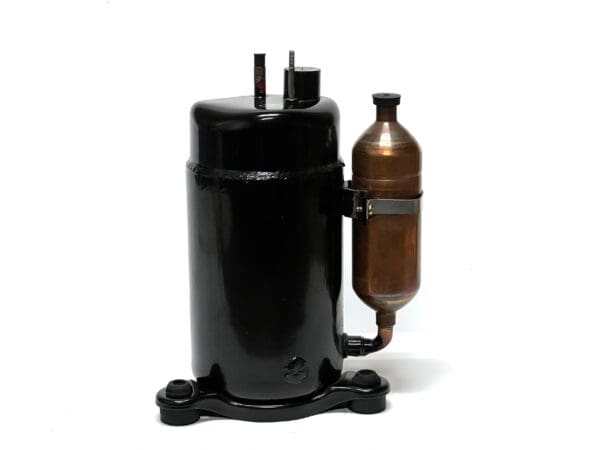 A black and brown air compressor on top of a white floor.