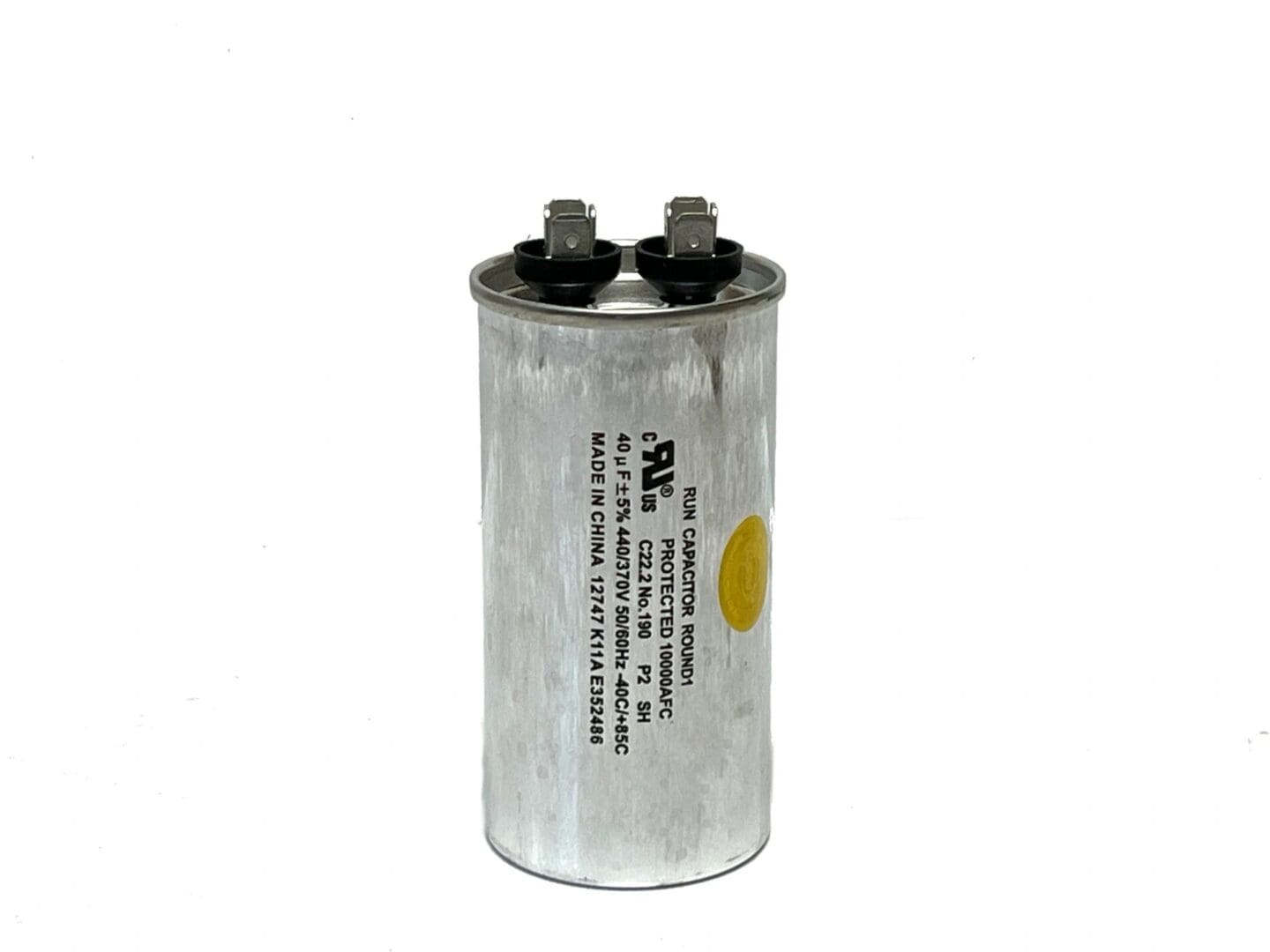 A capacitor is shown with the words " oil " on it.