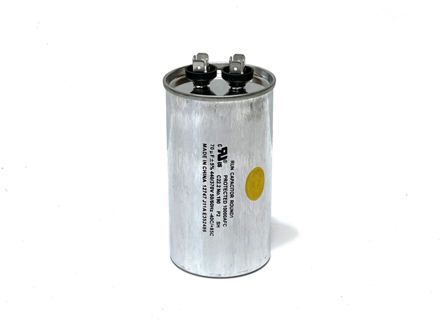 A close up of a capacitor on a white background