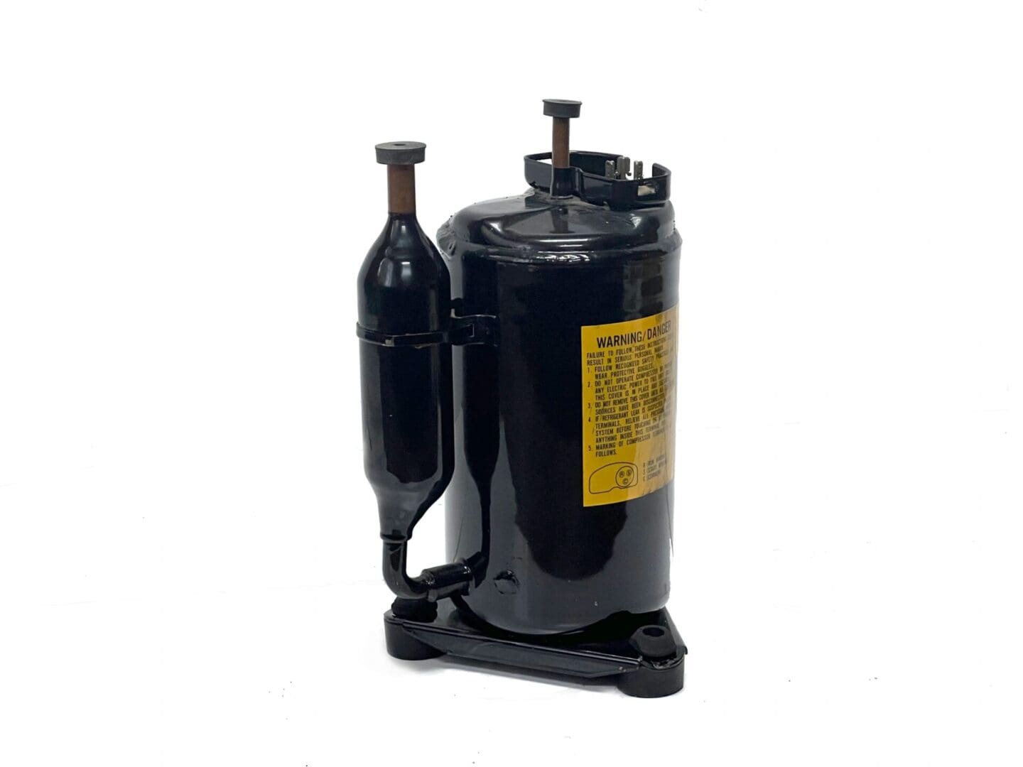 A black compressor with a yellow label on it.
