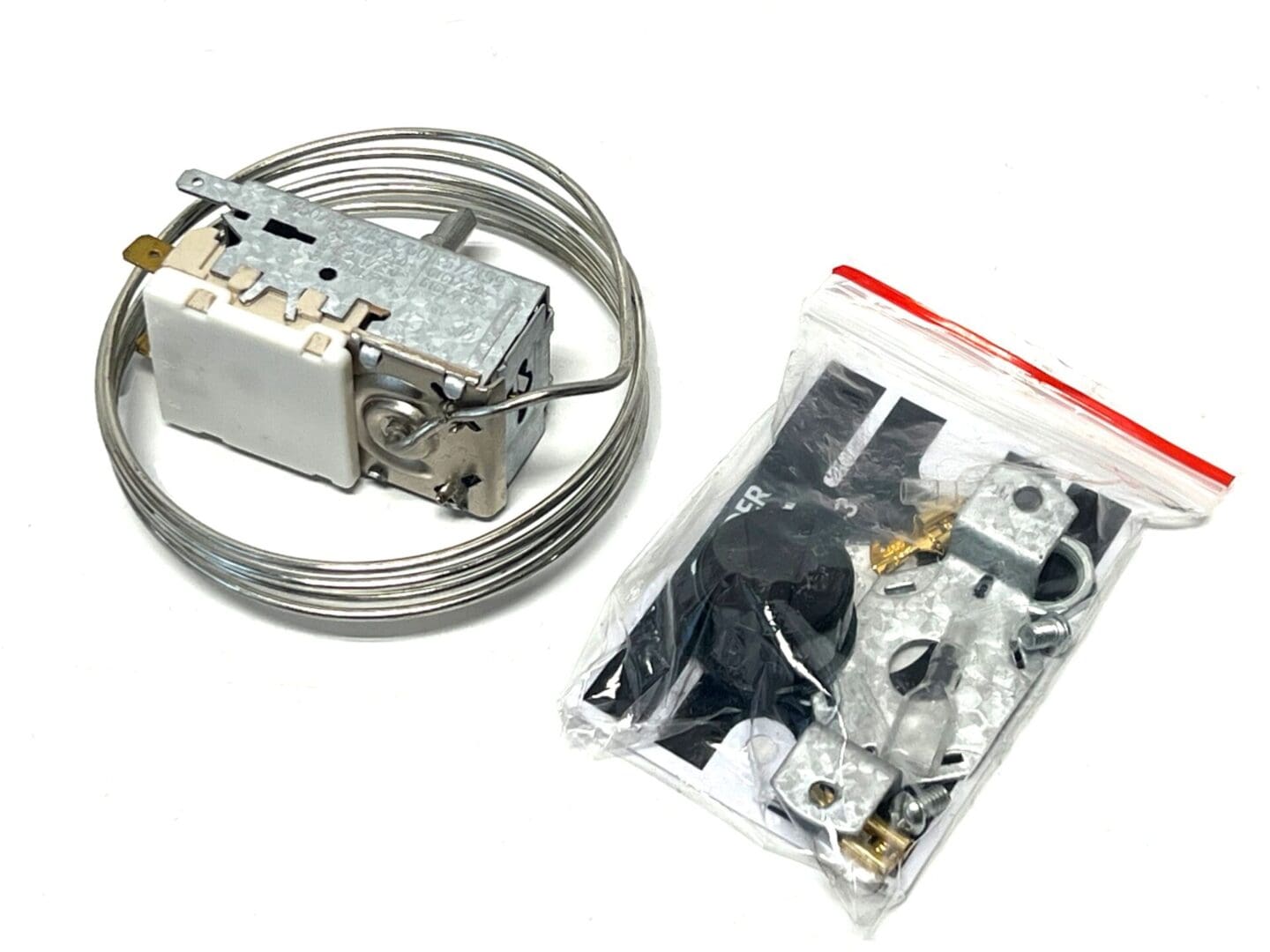A thermostat and some wires in a package.