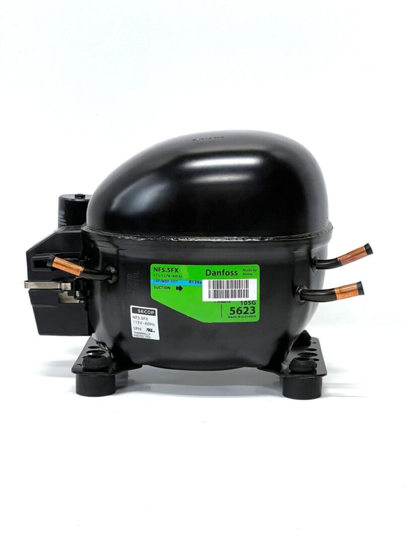 A black compressor with the label " green " on it.