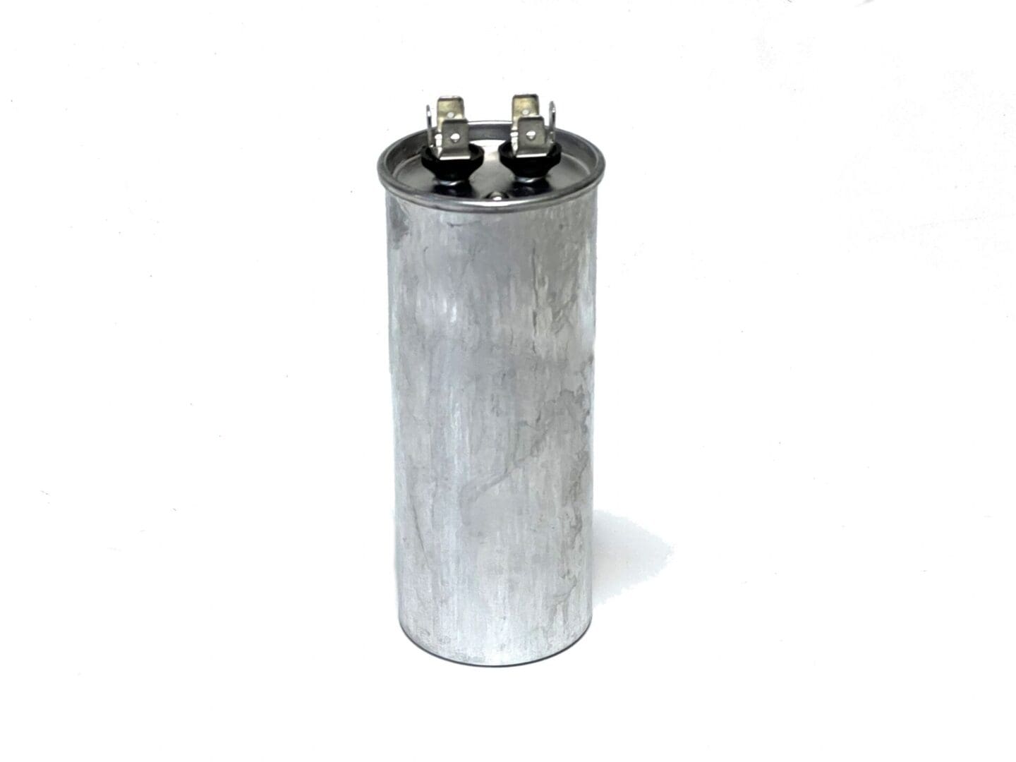 A close up of an electric motor capacitor