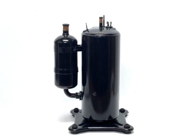 A black air compressor on top of a white table.