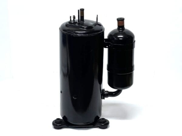 A black air conditioner compressor with a bottle of wine.