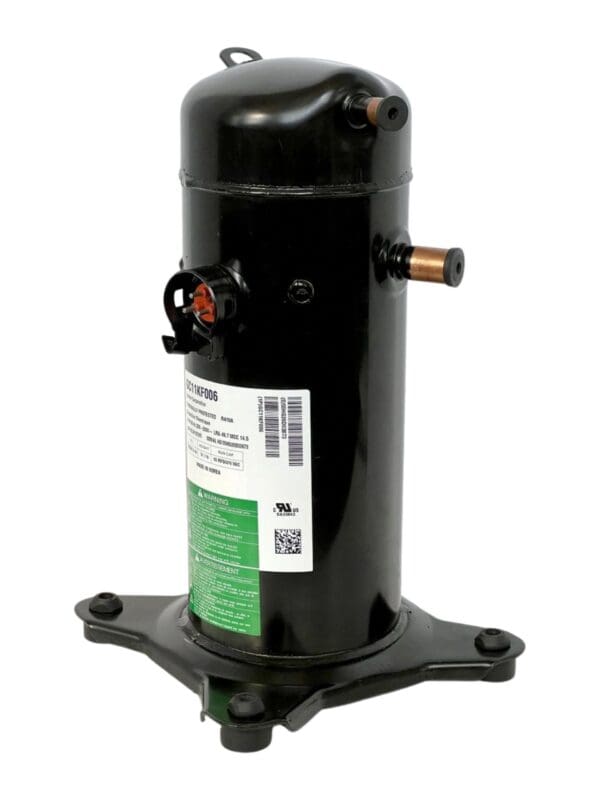 A black compressor sitting on top of a white table.