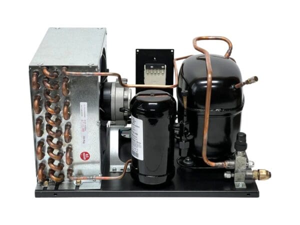 A black and silver compressor unit with copper piping.
