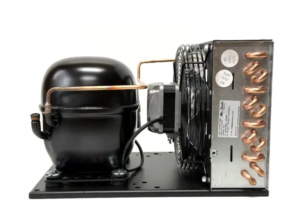 Refrigeration compressor unit with copper tubing.