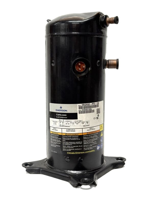 Black cylindrical Emerson compressor unit.